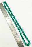 Luminescent Gleaming Green Enamel Coated Beads in a Long Sturdy Necklace