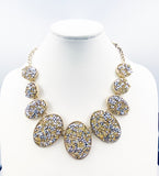 Textured Necklace with Oval Mounts with Faux Druzy of Faceted Metallic Cones and Yellow Beads