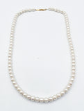 Sturdy Glowing Faux Pearl Necklace strung on Gold-Tone Metal Chain with Patented Clasp