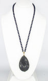 Mystic Faceted Grey Gemstone Pendant on Blue Wood and Golden Bead Necklace